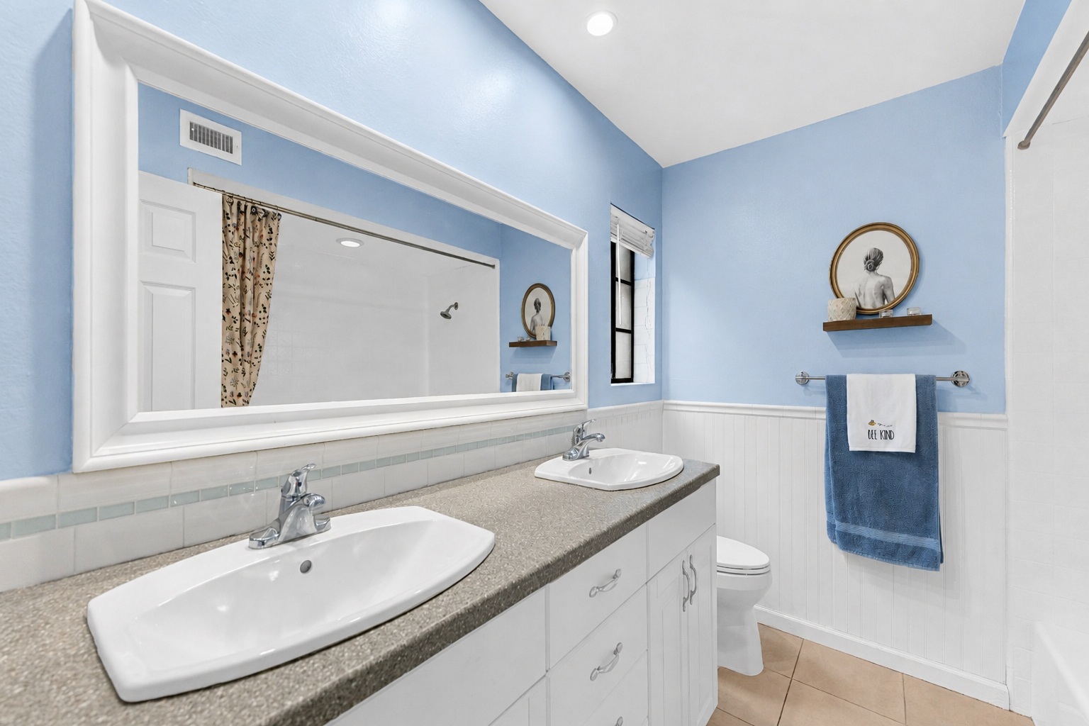 Updated primary bathroom with double sink vanity